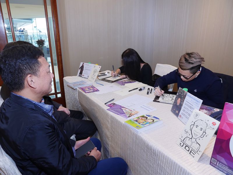 Two artists with disability from the Arts with the Disabled Association of Hong Kong were invited to provide portrait sketch service.